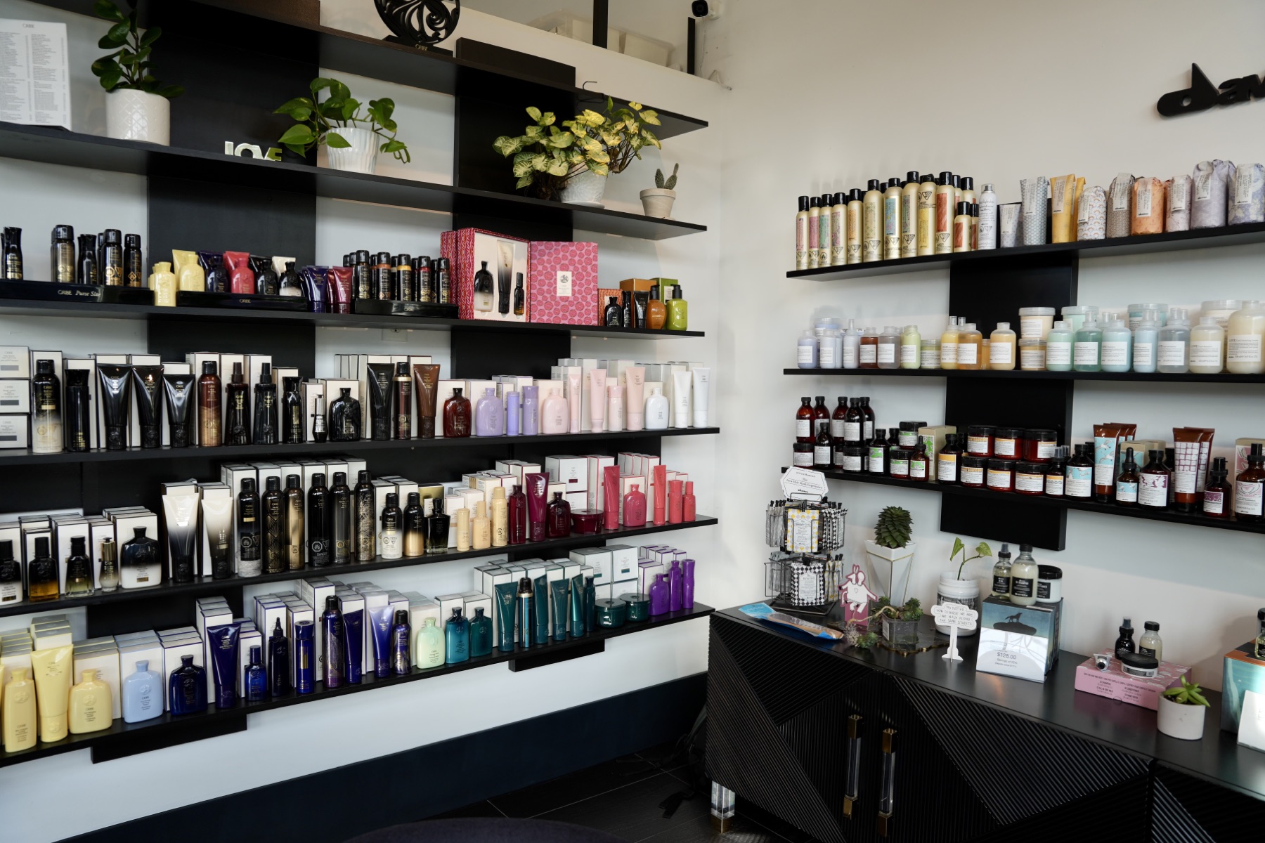 Retail shelves of professional hair products at MOD Salon in Kelowna