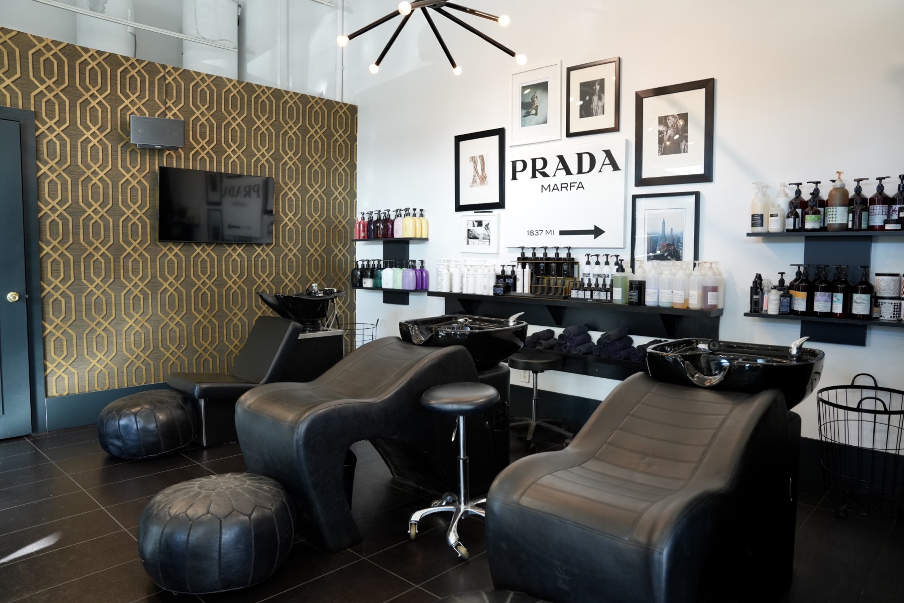 Best Kelowna Hair Salon: Reclining wash chairs and leather poufs in the shampoo area