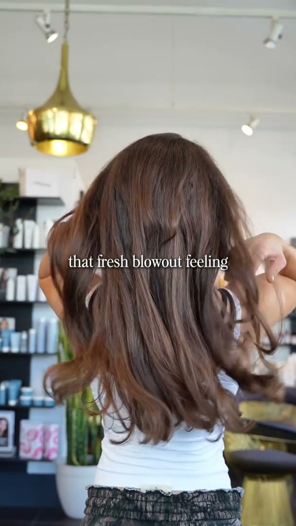 Best Kelowna Hair Salon: Freshly blown-out long brunette hair at MOD Salon