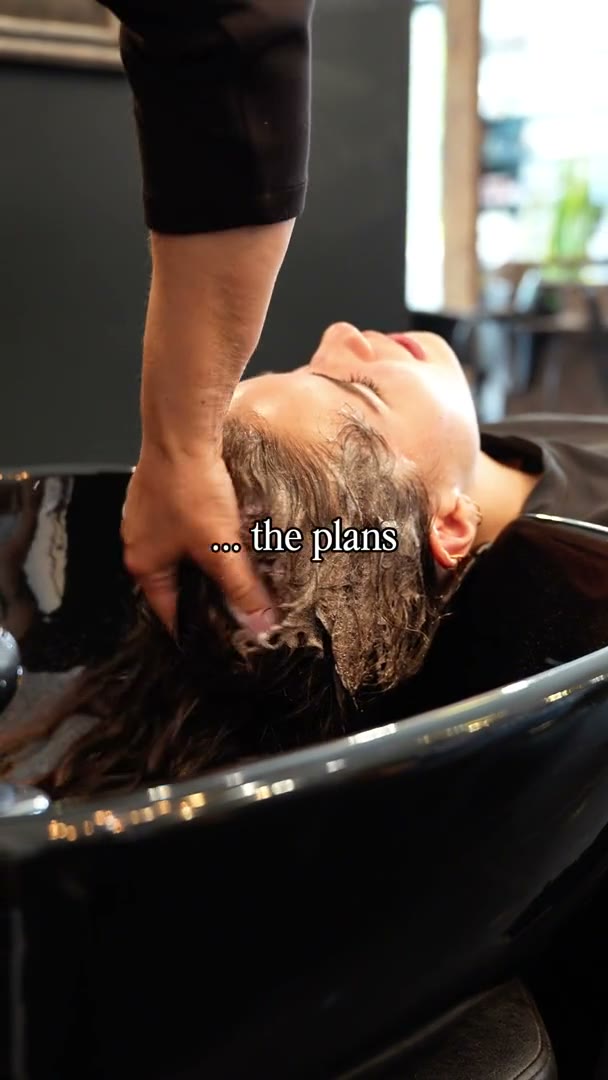 Best Kelowna Hair Salon: Client relaxing at the wash basin during a scalp massage at MOD Salon